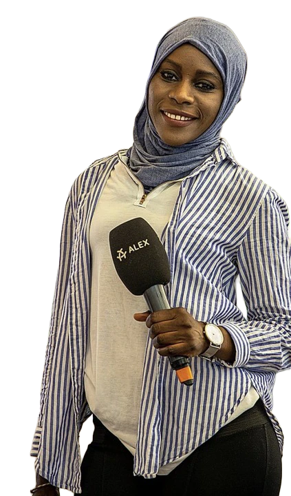Nyima holding a microphone